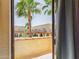View from the balcony showcases a community pool and palm trees at 16336 E Palisades Blvd # 9, Fountain Hills, AZ 85268