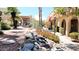 Inviting community walkway with lush landscaping and a glimpse of the pool at 16336 E Palisades Blvd # 9, Fountain Hills, AZ 85268