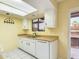 Clean kitchen with white cabinets and a view to the outside at 16336 E Palisades Blvd # 9, Fountain Hills, AZ 85268