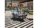Community patio area with shaded seating and outdoor dining set at 16336 E Palisades Blvd # 9, Fountain Hills, AZ 85268