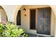 Inviting condo entrance with security door and landscaping at 16336 E Palisades Blvd # 9, Fountain Hills, AZ 85268