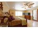 Bright Primary bedroom with large bed, access to patio, and ample closet space at 10220 E Cochise Dr, Scottsdale, AZ 85258