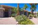 Inviting home exterior with a charming entrance and mature landscaping at 10220 E Cochise Dr, Scottsdale, AZ 85258