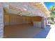 Large garage with built-in storage and epoxy flooring at 10220 E Cochise Dr, Scottsdale, AZ 85258
