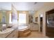 Large Primary bathroom with double sinks, soaking tub, and walk-in shower at 10220 E Cochise Dr, Scottsdale, AZ 85258