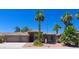 Beautiful two-story home with a three-car garage and lush landscaping at 10220 E Cochise Dr, Scottsdale, AZ 85258