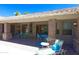 Stone patio with comfortable seating and views at 10220 E Cochise Dr, Scottsdale, AZ 85258