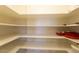 Walk-in pantry with ample shelving for storage at 10220 E Cochise Dr, Scottsdale, AZ 85258