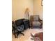 Office space with a comfortable chair and a desk at 10220 E Cochise Dr, Scottsdale, AZ 85258