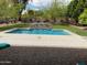 Inviting backyard pool with a stone fountain at 10220 E Cochise Dr, Scottsdale, AZ 85258
