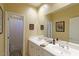 Bathroom with double sinks and shower/tub combo at 10220 E Cochise Dr, Scottsdale, AZ 85258