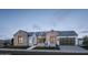 Stunning farmhouse-style home with stone accents and a large garage at 3950 E Penedes Dr, Gilbert, AZ 85298