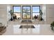 Modern kitchen with white countertops, stainless steel appliances, and large windows at 24046 N 126Th Pl, Scottsdale, AZ 85255