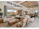 Luminous living room showcases a large sectional sofa and sliding doors opening to the backyard at 24046 N 126Th Pl, Scottsdale, AZ 85255