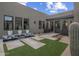 Modern home exterior featuring a water feature and drought-tolerant landscaping at 24046 N 126Th Pl, Scottsdale, AZ 85255