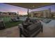 Relaxing backyard with covered patio, pool, and lounge seating at 24046 N 126Th Pl, Scottsdale, AZ 85255
