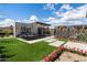 Backyard oasis featuring a water feature, artificial turf, and geometric screens at 24046 N 126Th Pl, Scottsdale, AZ 85255