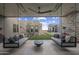 Covered patio with swing seating, offering comfortable outdoor relaxation at 24046 N 126Th Pl, Scottsdale, AZ 85255