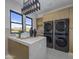 Laundry room with modern washer and dryer, and a quartz countertop at 24046 N 126Th Pl, Scottsdale, AZ 85255