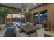 Elegant dining room with a large wooden table and stunning sunset views at 24046 N 126Th Pl, Scottsdale, AZ 85255