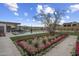 Expansive backyard with a luxurious pool, lush landscaping, and outdoor seating at 24046 N 126Th Pl, Scottsdale, AZ 85255