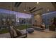 Relaxing patio with hanging sofas and views of the backyard at 24046 N 126Th Pl, Scottsdale, AZ 85255
