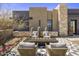Inviting front yard features a fire pit and stylish seating area perfect for outdoor relaxation at 24046 N 126Th Pl, Scottsdale, AZ 85255
