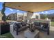 Relaxing patio with outdoor seating and a built-in grill station at 24046 N 126Th Pl, Scottsdale, AZ 85255