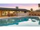 Inviting backyard oasis featuring a sparkling pool and relaxing patio furniture at 3233 S Lebanon Ln, Tempe, AZ 85282