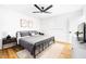 Main bedroom with a king-size bed and updated decor at 3233 S Lebanon Ln, Tempe, AZ 85282