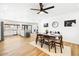 Open concept kitchen and dining area with modern appliances and hardwood floors at 3233 S Lebanon Ln, Tempe, AZ 85282