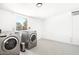 Bright laundry room with modern washer and dryer, and stylish flooring at 3233 S Lebanon Ln, Tempe, AZ 85282