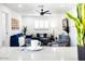 Open concept living room with blue sofa and view to kitchen at 3233 S Lebanon Ln, Tempe, AZ 85282