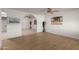 Living room with wood-look flooring, a ceiling fan, and an archway at 2226 N 61St Ave, Phoenix, AZ 85035