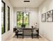 Modern home office with large windows and ample desk space at 2659 E Maplewood St, Gilbert, AZ 85297