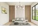 Main bedroom with large window and wood wall at 2659 E Maplewood St, Gilbert, AZ 85297