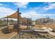 Community park with playground, shade structures, and benches at 2659 E Maplewood St, Gilbert, AZ 85297