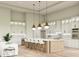 Modern kitchen with island and white cabinets at 2659 E Maplewood St, Gilbert, AZ 85297