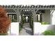 Covered entryway with pergola, walkway, and landscaping at 2659 E Maplewood St, Gilbert, AZ 85297