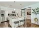 Modern kitchen with white cabinets, granite island, and wood floors at 1408 W 7Th St, Tempe, AZ 85281