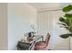 Home office features a wooden desk, laptop, and comfortable chair at 1408 W 7Th St, Tempe, AZ 85281