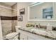 Bathroom with granite countertop, white sink and shower with tile surround at 1408 W 7Th St, Tempe, AZ 85281