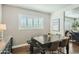 Modern dining room with dark wood table and four chairs at 1408 W 7Th St, Tempe, AZ 85281