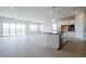 Open living room and kitchen with light wood flooring at 1323 E Eleana Ln, Gilbert, AZ 85298