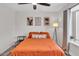Bedroom with beige bedding and ceiling fan at 3406 E Libby St, Phoenix, AZ 85032