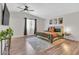Spacious main bedroom with hardwood floors, a large bed, and stylish decor at 3406 E Libby St, Phoenix, AZ 85032