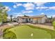 Backyard with putting green and patio at 3406 E Libby St, Phoenix, AZ 85032