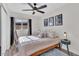 Bedroom with a queen bed and ceiling fan at 3406 E Libby St, Phoenix, AZ 85032