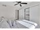 Bright bedroom with a queen bed, closet, and ceiling fan at 3406 E Libby St, Phoenix, AZ 85032