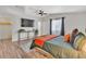Spacious bedroom with a large TV and en-suite bathroom at 3406 E Libby St, Phoenix, AZ 85032
